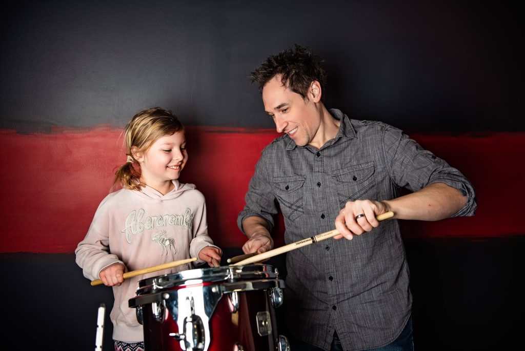 John teaching drums